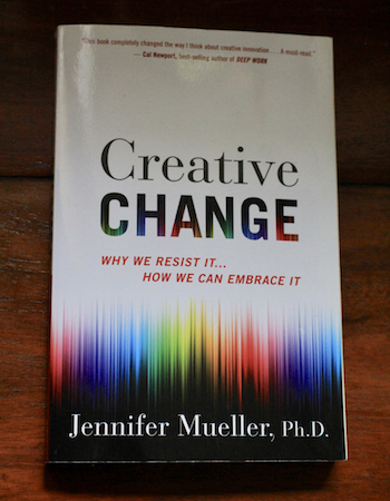 The Creative Change book on a table.