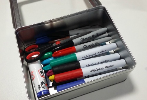 Photo showing the box filled with pens