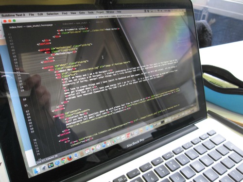 Photo of my computer showing lots of code