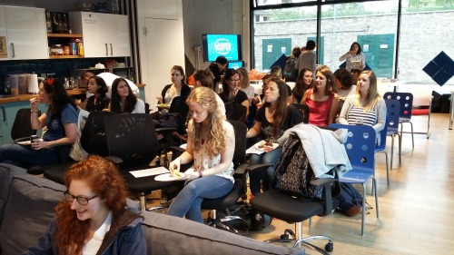 photo of everyone sitting in the kitchen waiting to be briefed